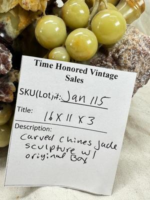 Sale Photo Thumbnail #271: Realistic grapes in a basket sits on  the raw rock base. Very large and heavy Rock sculpture, cannot be shipped. 16" tall with original padded box.