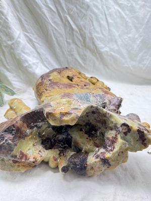 Sale Photo Thumbnail #275: Realistic grapes in a basket sits on  the raw rock base. Very large and heavy Rock sculpture, cannot be shipped. 16" tall with original padded box.