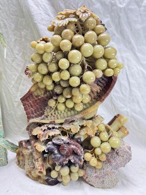 Sale Photo Thumbnail #269: Realistic grapes in a basket sits on  the raw rock base. Very large and heavy Rock sculpture, cannot be shipped. 16" tall with original padded box.
