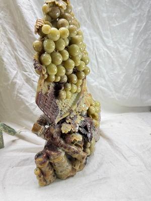Sale Photo Thumbnail #273: Realistic grapes in a basket sits on  the raw rock base. Very large and heavy Rock sculpture, cannot be shipped. 16" tall with original padded box.