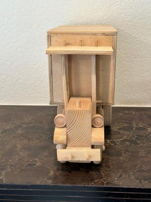 HAND CRAFTED WOODEN TOYS WITH AN EMBEDDED PENNY FOR THE YEAR THEY WERE MADE