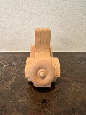 HAND CRAFTED WOODEN TOYS WITH AN EMBEDDED PENNY FOR THE YEAR THEY WERE MADE