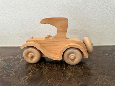 HAND CRAFTED WOODEN TOYS WITH AN EMBEDDED PENNY FOR THE YEAR THEY WERE MADE