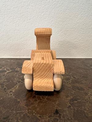 HAND CRAFTED WOODEN TOYS WITH AN EMBEDDED PENNY FOR THE YEAR THEY WERE MADE