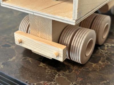 HAND CRAFTED WOODEN TOYS WITH AN EMBEDDED PENNY FOR THE YEAR THEY WERE MADE