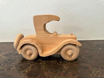 HAND CRAFTED WOODEN TOYS WITH AN EMBEDDED PENNY FOR THE YEAR THEY WERE MADE