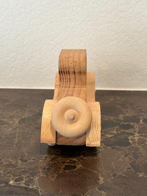 HAND CRAFTED WOODEN TOYS WITH AN EMBEDDED PENNY FOR THE YEAR THEY WERE MADE