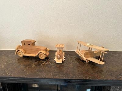 HAND CRAFTED WOODEN TOYS WITH AN EMBEDDED PENNY FOR THE YEAR THEY WERE MADE