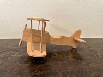 HAND CRAFTED WOODEN TOYS WITH AN EMBEDDED PENNY FOR THE YEAR THEY WERE MADE