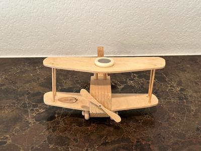 HAND CRAFTED WOODEN TOYS WITH AN EMBEDDED PENNY FOR THE YEAR THEY WERE MADE