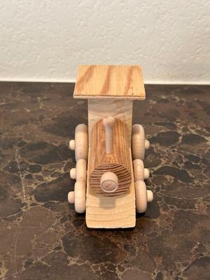 HAND CRAFTED WOODEN TOYS WITH AN EMBEDDED PENNY FOR THE YEAR THEY WERE MADE