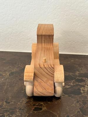 HAND CRAFTED WOODEN TOYS WITH AN EMBEDDED PENNY FOR THE YEAR THEY WERE MADE