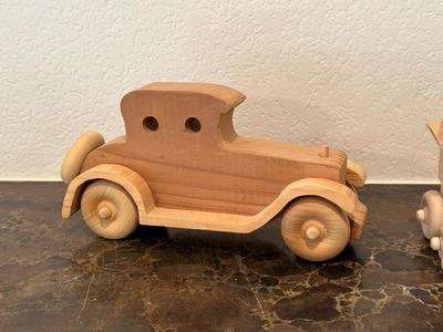 HAND CRAFTED WOODEN TOYS WITH AN EMBEDDED PENNY FOR THE YEAR THEY WERE MADE