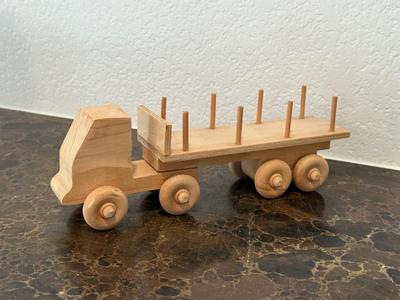 HAND CRAFTED WOODEN TOYS WITH AN EMBEDDED PENNY FOR THE YEAR THEY WERE MADE