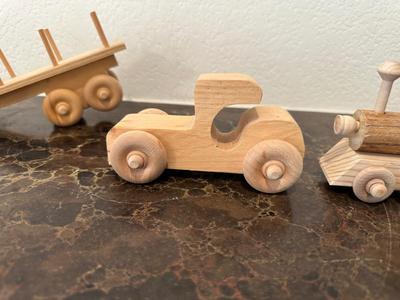 HAND CRAFTED WOODEN TOYS WITH AN EMBEDDED PENNY FOR THE YEAR THEY WERE MADE