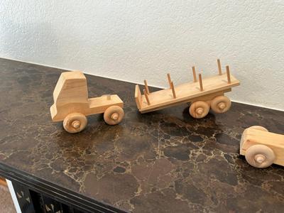 HAND CRAFTED WOODEN TOYS WITH AN EMBEDDED PENNY FOR THE YEAR THEY WERE MADE