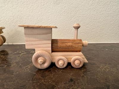 HAND CRAFTED WOODEN TOYS WITH AN EMBEDDED PENNY FOR THE YEAR THEY WERE MADE