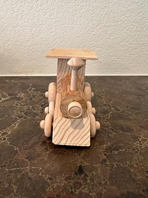 HAND CRAFTED WOODEN TOYS WITH AN EMBEDDED PENNY FOR THE YEAR THEY WERE MADE