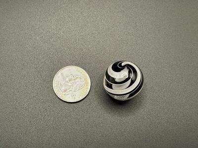 WHITE LATTICINIO SWIRL CORE MARBLE WITH BLACK AND WHITE SWIRLS