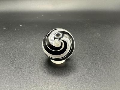 WHITE LATTICINIO SWIRL CORE MARBLE WITH BLACK AND WHITE SWIRLS