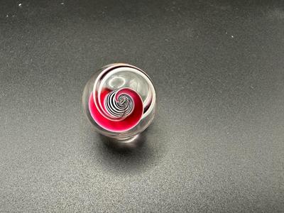 BLACK AND WHITE LATTICINIO CORE MARBLE WITH WHITE, RED, BLACK RIBBONS