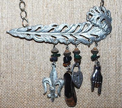 Silver Tone METAL FEATHER NECKLACE with 4 Assorted Charms and Beads on a Silve Tone Chain & Circle Clasp 17" L