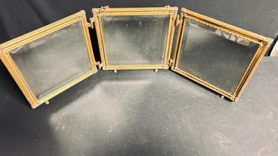 EARLY 20TH CENTURY ORMOLU BARBER MIRROR WITH A LEATHER RAISED DECORATIVE MOTIF