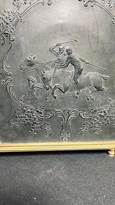 EARLY 20TH CENTURY ORMOLU BARBER MIRROR WITH A LEATHER RAISED DECORATIVE MOTIF