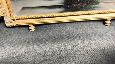 EARLY 20TH CENTURY ORMOLU BARBER MIRROR WITH A LEATHER RAISED DECORATIVE MOTIF