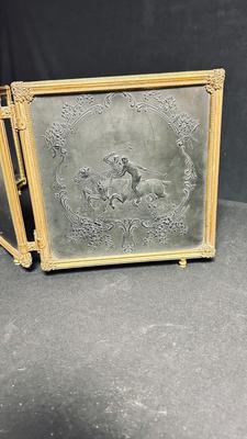 EARLY 20TH CENTURY ORMOLU BARBER MIRROR WITH A LEATHER RAISED DECORATIVE MOTIF