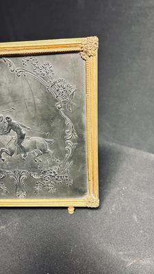 EARLY 20TH CENTURY ORMOLU BARBER MIRROR WITH A LEATHER RAISED DECORATIVE MOTIF