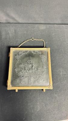 EARLY 20TH CENTURY ORMOLU BARBER MIRROR WITH A LEATHER RAISED DECORATIVE MOTIF