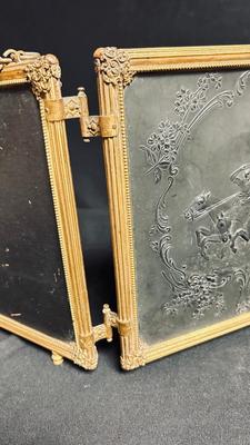 EARLY 20TH CENTURY ORMOLU BARBER MIRROR WITH A LEATHER RAISED DECORATIVE MOTIF