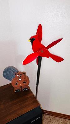 THE CARDINAL STAKED YARD ART AND A WOODEN BEAVER