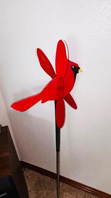 THE CARDINAL STAKED YARD ART AND A WOODEN BEAVER