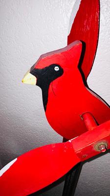 THE CARDINAL STAKED YARD ART AND A WOODEN BEAVER