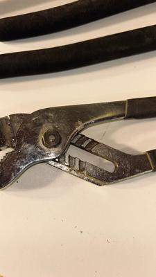 CROWBAR AND A SET OF CHANNEL LOCK PLIERS