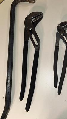 CROWBAR AND A SET OF CHANNEL LOCK PLIERS