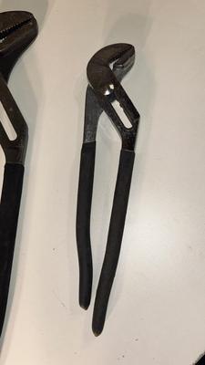 CROWBAR AND A SET OF CHANNEL LOCK PLIERS