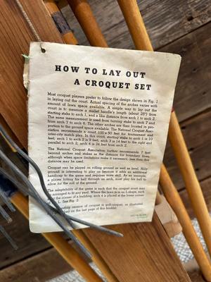 OLD CROQUET SET AND WOODEN STAKED YARD ART HOSE HOLDER