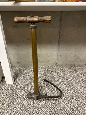 FORD MOTOR CO AIR PUMP AND WRENCH PLUS AN OLD TUBE STRAPPER