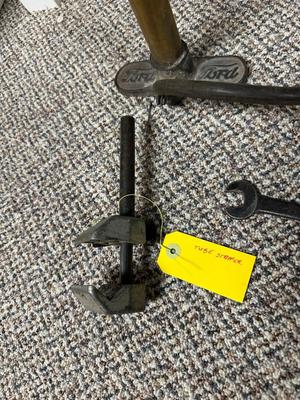 FORD MOTOR CO AIR PUMP AND WRENCH PLUS AN OLD TUBE STRAPPER