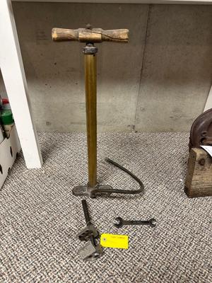 FORD MOTOR CO AIR PUMP AND WRENCH PLUS AN OLD TUBE STRAPPER