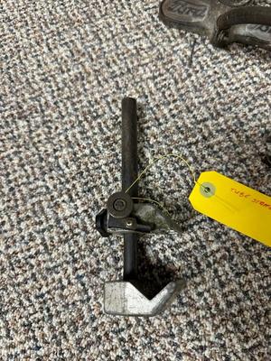 FORD MOTOR CO AIR PUMP AND WRENCH PLUS AN OLD TUBE STRAPPER