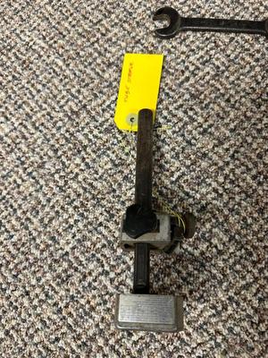 FORD MOTOR CO AIR PUMP AND WRENCH PLUS AN OLD TUBE STRAPPER