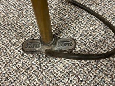 FORD MOTOR CO AIR PUMP AND WRENCH PLUS AN OLD TUBE STRAPPER