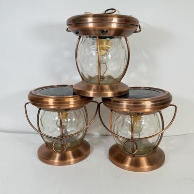 LOT 67: Three Copper & Brass Solar Powered Lanterns`