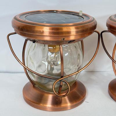 LOT 67: Three Copper & Brass Solar Powered Lanterns`