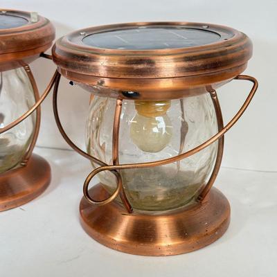 LOT 67: Three Copper & Brass Solar Powered Lanterns`