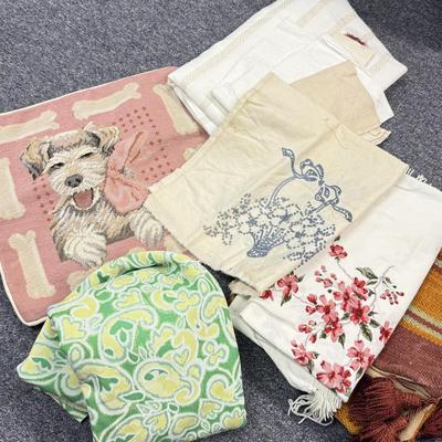LOT 102: Finished & Unifinished Quilts, Pink Dog Pillow Cover, Embroidered Fabrics & More